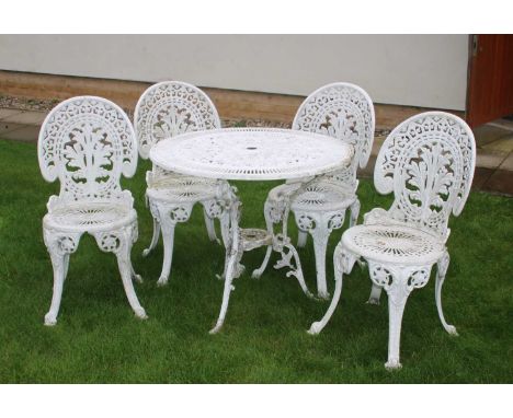 A modern white painted metal garden table and four chairs, table 80cm diameterCondition report: Light in weight, paint with g