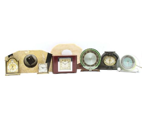 A collection of Art Deco and later clocks, comprising a marble clock garniture, a Mappin travel clock, an ebonised base with 