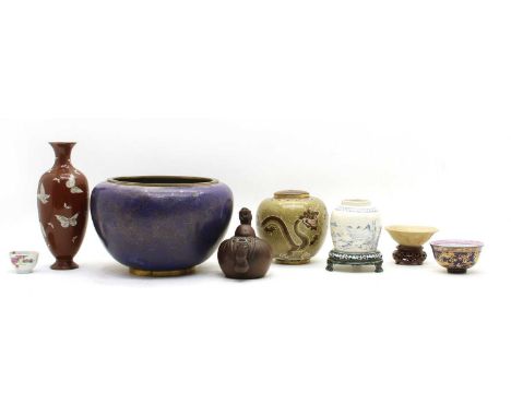 A Chinese red ware type teapot, 15cm wide, together with two tea bowls, a blue cloisonne bowl, two cloisonne vases, a Chinese