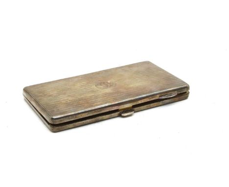 A silver cigarette case, W.M.Co., Birmingham 1925, of rectangular form with engraved linear decoration, monogrammed 'WS' and 