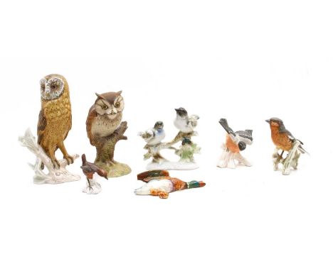 A collection of ceramic model birds, to include a large Goebel owl, CV112, 1969, 24cm high, three smaller Goebel bird example