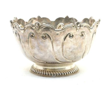 A late Victorian silver montieth, the scalloped rim interspersed by putti masks, on a gadrooned pedestal foot, London 1899, b