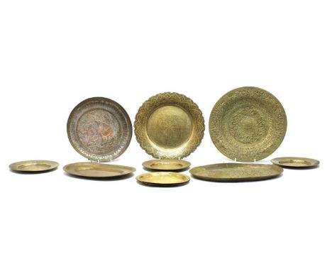 A silver plated copper Eastern tray travelling camel and bird motif, Cairoware oval tray and twelve various old Eastern trays