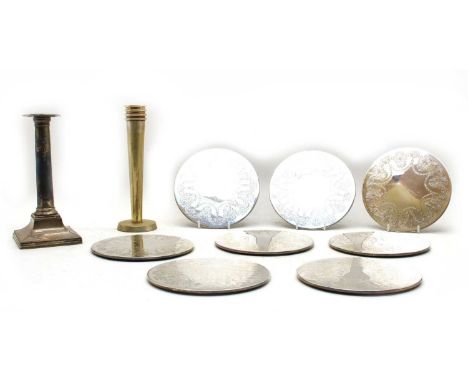 An Old Sheffield silver plated candlestick, and Art Deco reverse tapered example and eight plated silver platemats (qty.)
