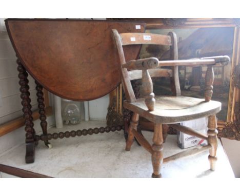 A 19th century oval walnut veneer drop leaf Sutherland table, raised on bobbin turned frame, together with a child's chair (2