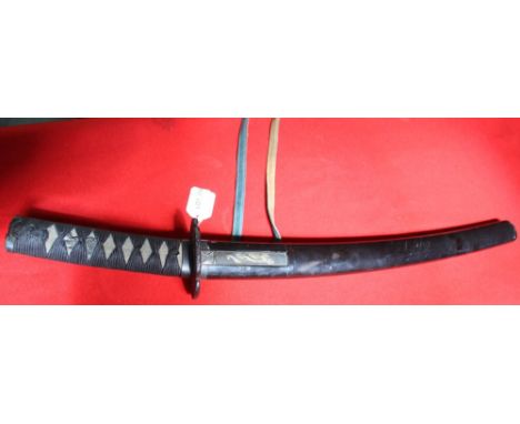 A Japanese sword with shagreen handle cord wrapped. Cast Tsuba. the lacquer scabbard inset small knife, the entire length 66 