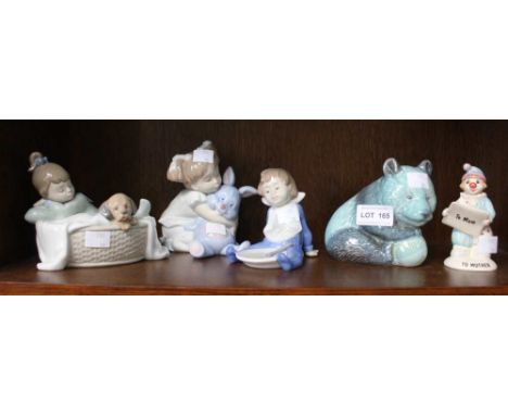 A shelf to include three Nao figurines and two Beswick examples (5)