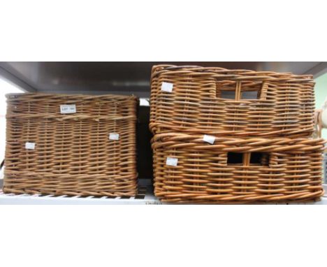 A shelf containing five wicker baskets