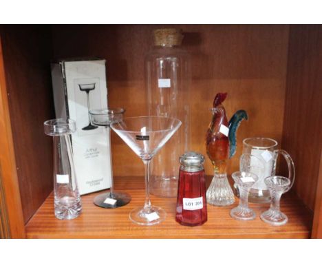 A shelf containing a collection of glass ware, including a Murano cockerel, Wedgwood crystal candle holder etc&nbsp;