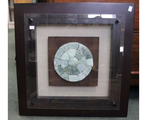A modern jade plate in shadow box