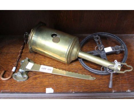 A brass clockwork spit-engine, with wall bracket, extra hook and iron meat wheel (with key)