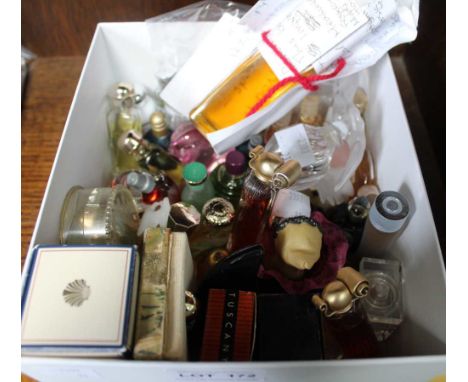 A box containing a selection of miniature modern and vintage perfumes
