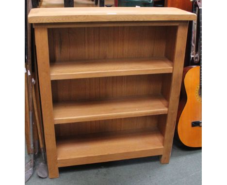 A modern beech three shelf bookcase