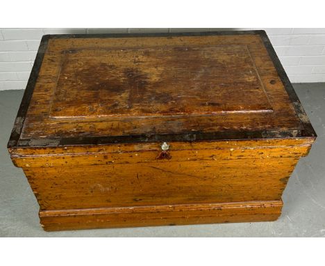 A LARGE 19TH CENTURY PINE CARPENTERS TRUNK, 102cm x 63cm x 60cm The rising lid opening to reveal a fitted interior.