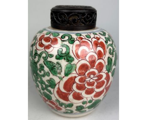 A CHINESE GINGER JAR GREEN AND RED PAINTED WITH ROSEWOOD TOP, Kangxi style but later 