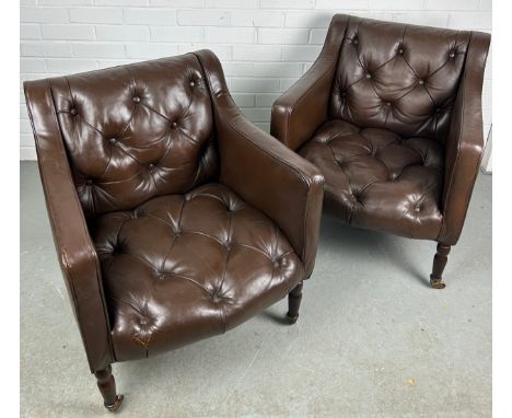 A PAIR OF BROWN LEATHER BUTTON BACK CLUB CHAIRS, Removed from Brown's Club London. Each raised on four legs and castors. 