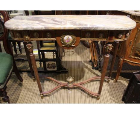 A FRENCH DESIGN MARBLE TOPPED CONSOLE TABLE with applied ceramic effect roundels, supported on four tapering reeded legs 