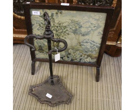 A TAPESTRY FIRESCREEN together with a cast iron utensil stand 