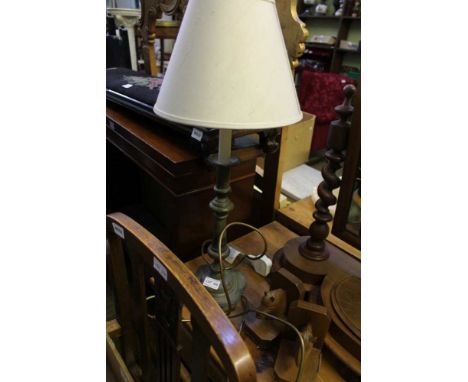 A PAIR OF CARVED WOODEN BOOKENDS IN THE FORM OF HORSES HEADS together with a brass column table light 