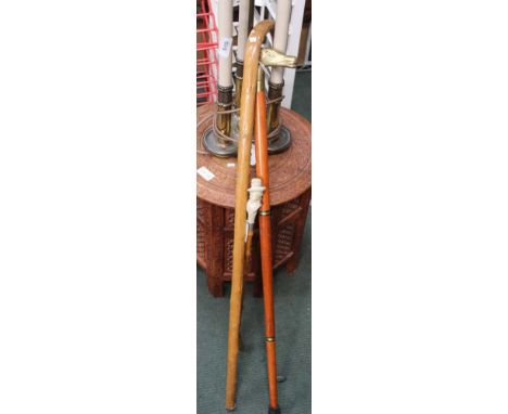 AN INDIAN CARVED INLAID AND PIERCED OCCASIONAL TABLE together with a three-column light, two walking sticks and a shoe horn 