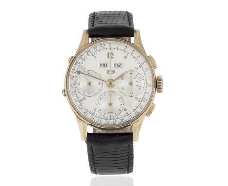 Heuer. A 14K gold manual wind triple calendar wristwatchDate: Circa 1950Movement: 17-jewel Valjoux Cal.72C manual wind, colum