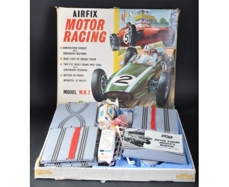 A vintage Airfix made Scalextric style 1/32 scale slot car motor racing set No. 4999. The set containing circuit track with c