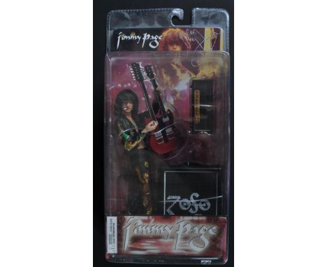 An original Neca made Led Zeppellin action figure Jimmy Page. The figure dressed in his dragon suit complete with double neck