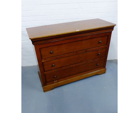 A contemporary mahogany chest of drawers having a moulded top over secret drawer and three graduating drawers raised on brack