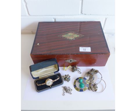 A stained wood jewellery box containing a vintage gold plated wristwatch, two silver bangles, an enamel brooch etc (a lot) 