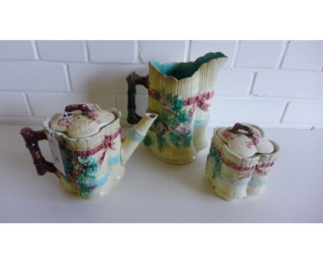 Scottish majolica to include a bamboo and floral relief decorated quatrefoil shaped teapot and cover together with a matching
