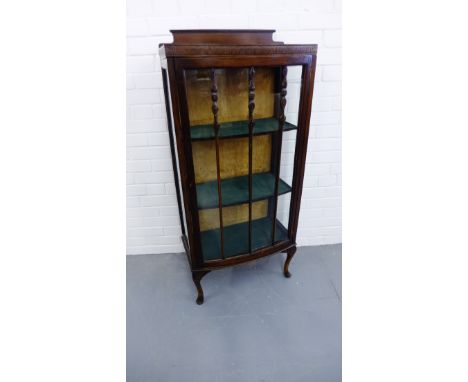 A mahogany display case having a glazed panel door enclosing shelved interior raised on cabriole legs, 57 x 130cm 