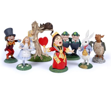 A COLLECTION OF SEVEN GOEBEL RESIN ALICE IN WONDERLAND FIGURES COMPRISING: Alice, Alice with the Cheshire Cat, the Mad Hatter