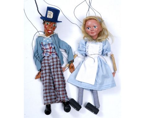 A PELHAM PUPPET 'Alice in Wonderland' standard puppet, and another, 'The Mad Hatter'; together with a box