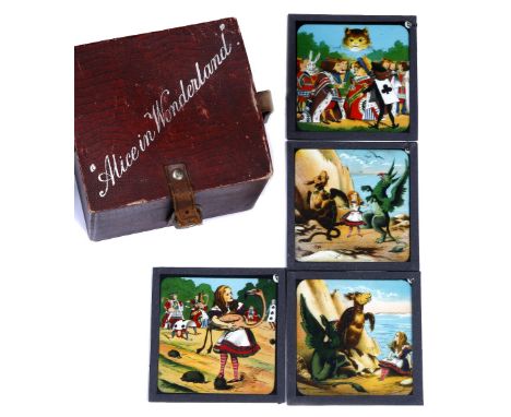 A SET OF TWENTY FOUR ALICE IN WONDERLAND COLOURED LANTERN SLIDES, boxed, with leather strap fastening