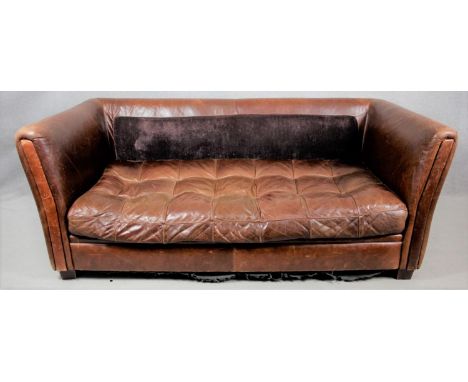 A tan leather tub sofa with buttoned cushion. Lacking its back cushion. H.78 W.19. D.95cm 