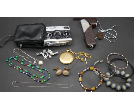 A collection of costume jewellery, a vintage Rollei 35 camera with case and other items. H.7 L.10.5 W.4cm (Camera) 