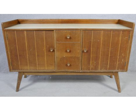 A mid century vintage teak Whiteleaf, Goodearl-Risboro sideboard with maker's label to the inside. H.86 W.138 D.45.5cm 