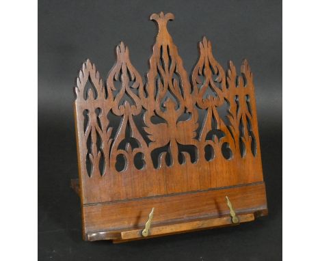 A Victorian mahogany adjustable table book or manuscript stand with Gothic pierced decoration. H.28cm 