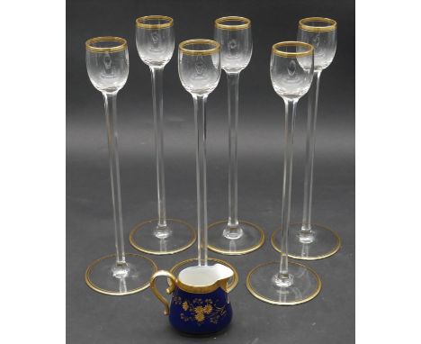 A set of six French gilt crystal tall stemmed liqueur glasses along with an M. Redon Limoges gilded porcelain jug with maker'