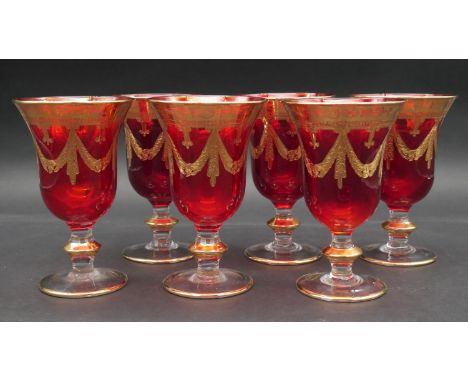A set of six ruby glass goblets etched and with gold leaf decoration. H.16cm 