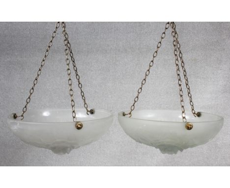 A pair of Art Deco opaque glass ceiling pendant light shades with moulded rose flowerhead decoration. Dia.34cm 