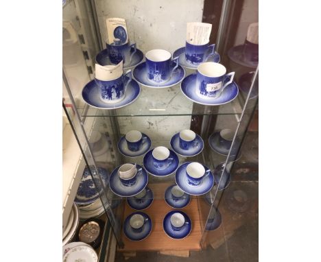 Fourteen Royal Copenhagen christmas cups and saucers 