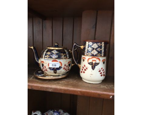 Pottery jug and teapot on stand 