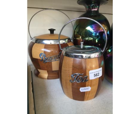 A tea caddy and biscuit barrel with lids and liners. 