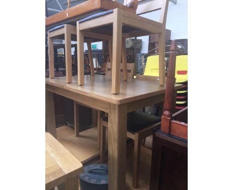 A Marks &amp; Spencer light oak extending dining table and 4 chairs 