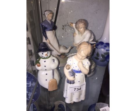 Four Royal Copenhagen figures of a girl with goose, boy with goose, snowman and girl with doll - good condition
