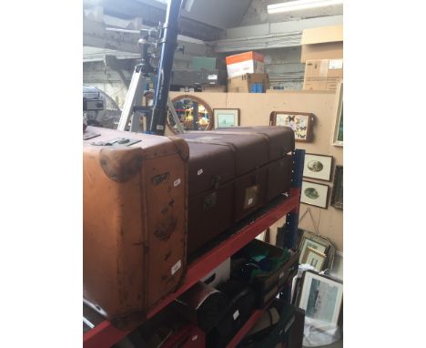 A vintage large trunk and a suitcase. 