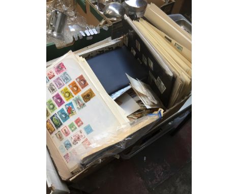 A box of loose stamps and first day covers 