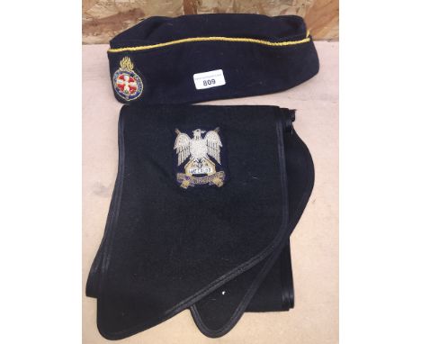 A Girl's Brigade side cap and a Royal Scotsdragoon Guards sash. 