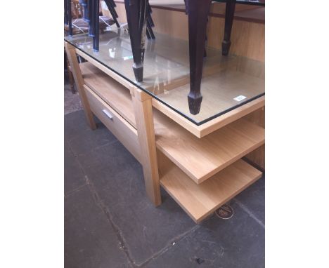 A modern light oak and glass sideboard 